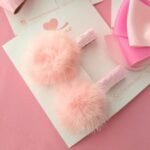 Par de pompons de pelúcia