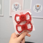 Par de laços pelúcia