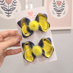 Par de laços pelúcia