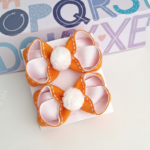 Par de laços pelúcia