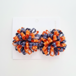 Par de pompons escolares