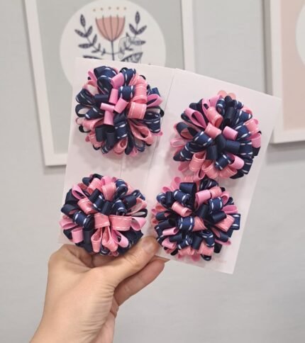 Par de pompons escolares