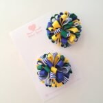 Par de pompons Hexa